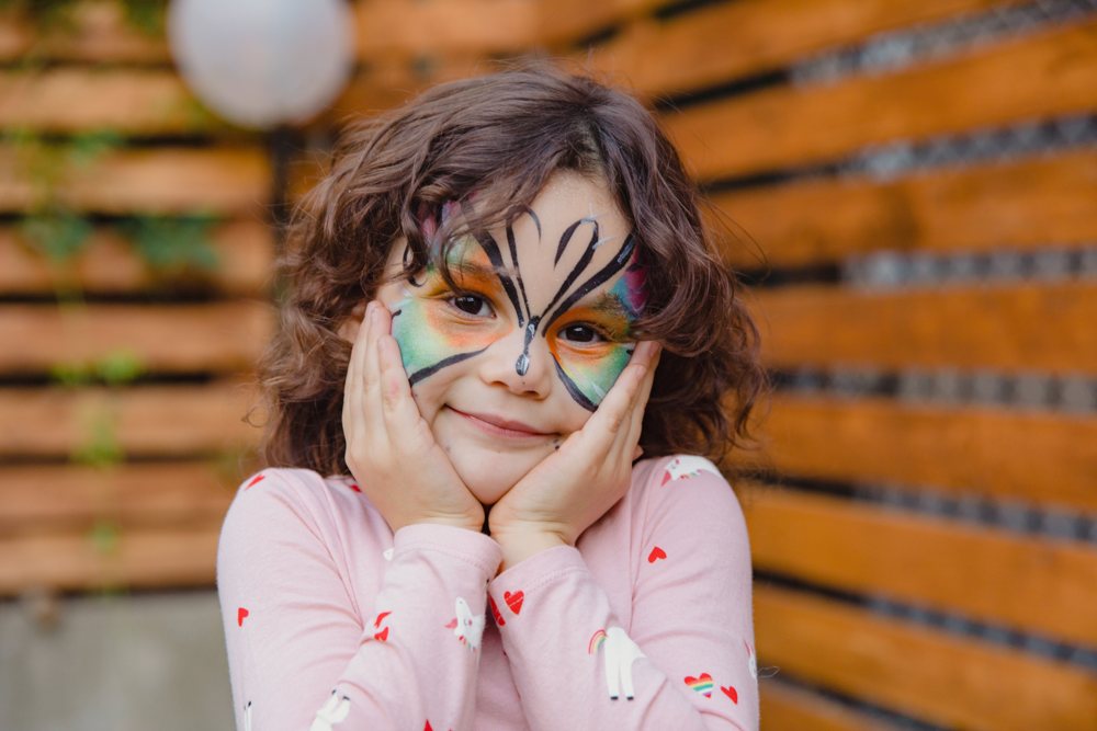 Colorful butterfly face-painting design