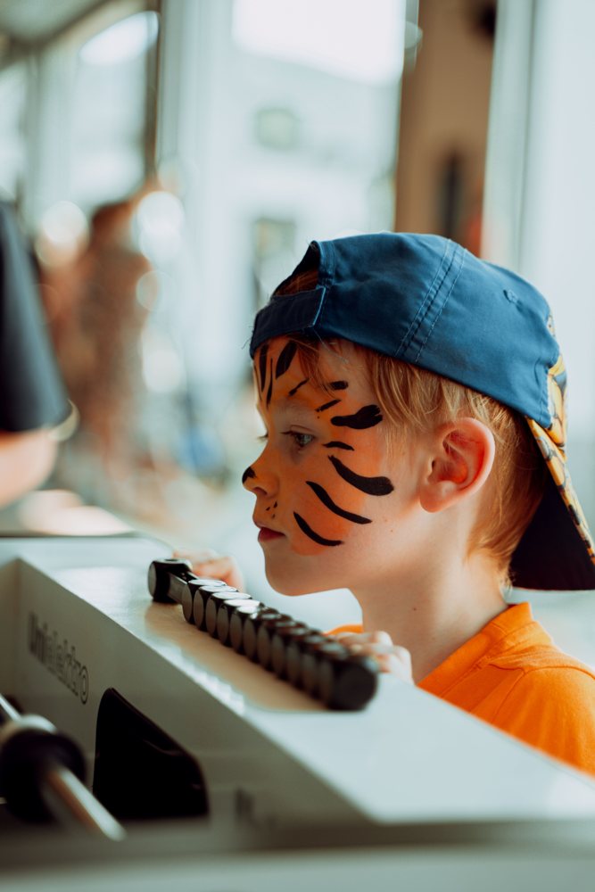 Orange and black tiger face-painting design